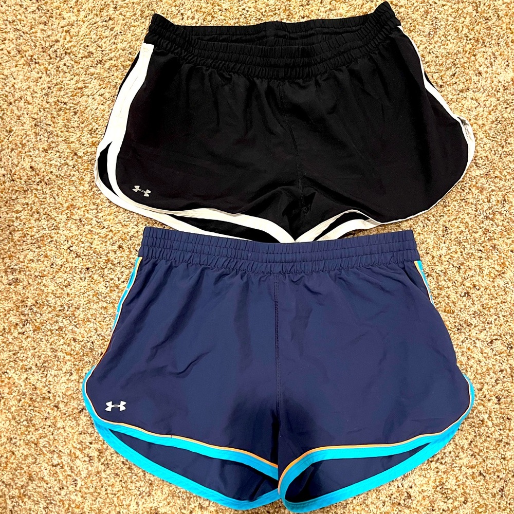 Under Armour shorts. Black and white and navy blue with orange.
